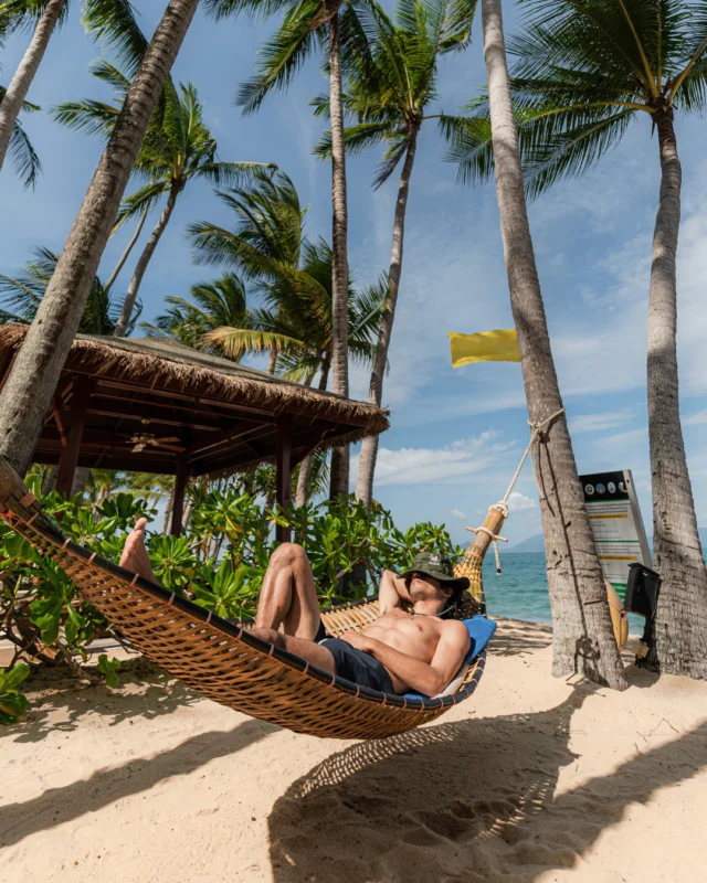 Find your own corner in Koh Samui.⁠
⁠
A quiet nap in a hammock or a floaty afternoon with your favourite read.⁠
⁠
Make paradise your own today.⁠
⁠
Photo courtesy of @opoetadacidade ⁠
⁠
⁠
#SantiburiKohSamui #สันติบุรีเกาะสมุย #SAiiDISCOVERY